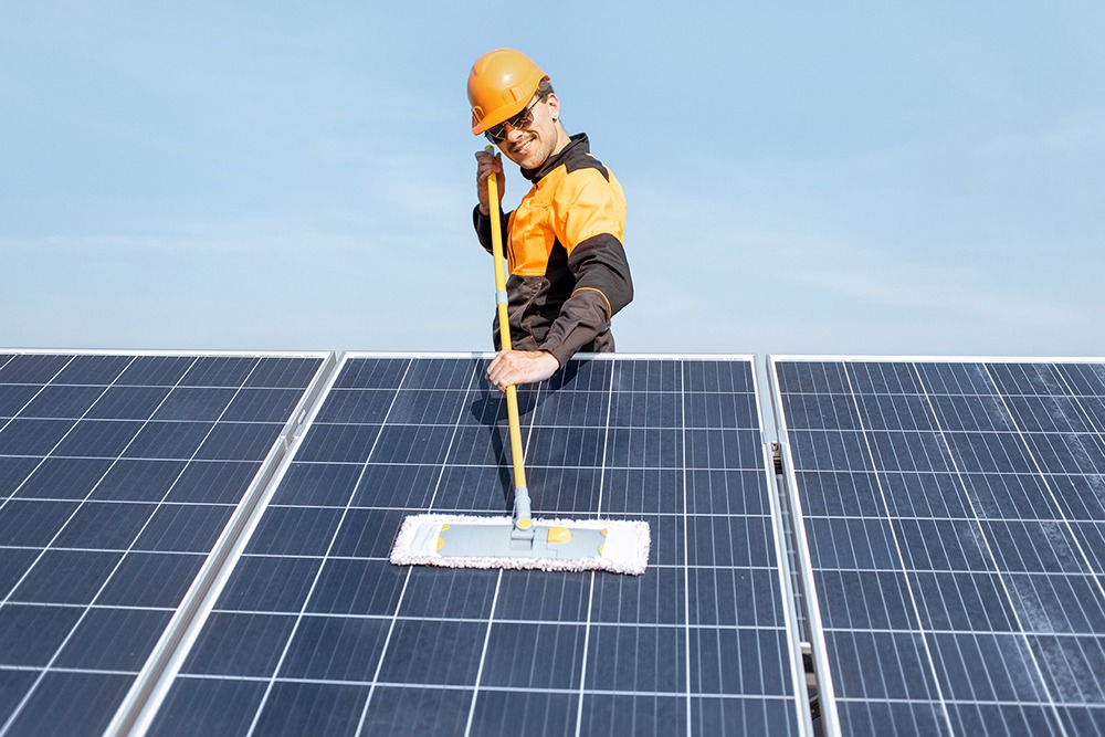 professional cleaning a solar panel